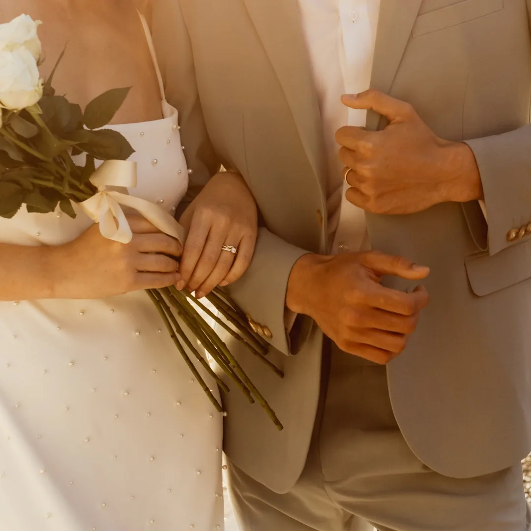 RAUSCHMAYER gold wedding bands worn on the wedding day