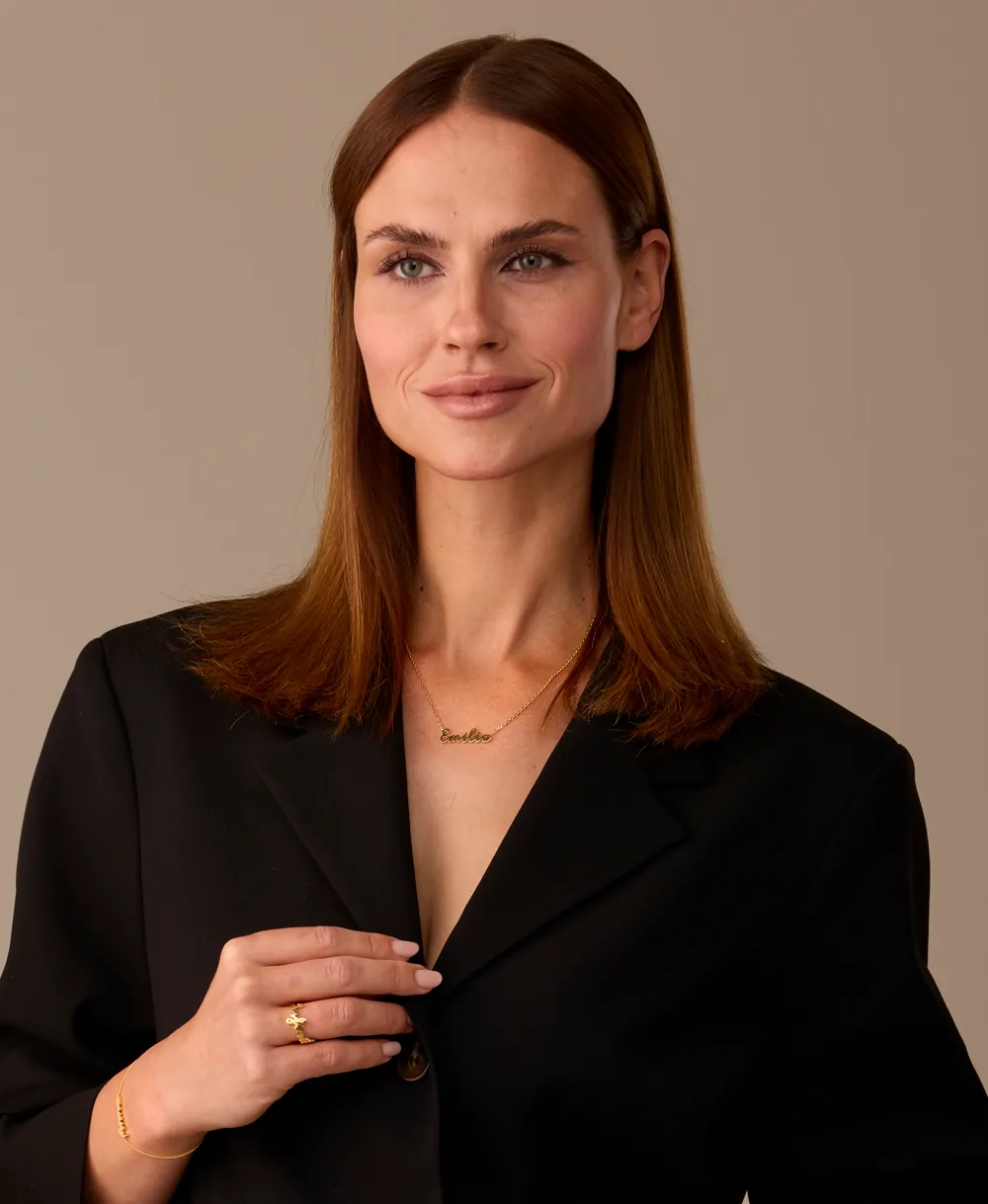 A personalised RAUSCHMAYER ring worn on the hand