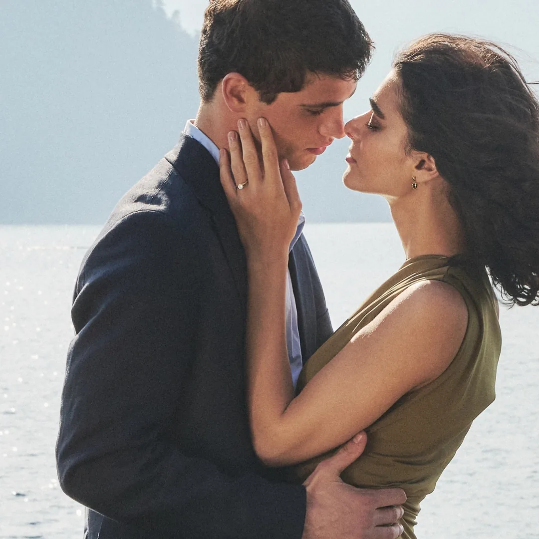 A couple at the water, the RAUSCHMAYER engagement ring on her hand